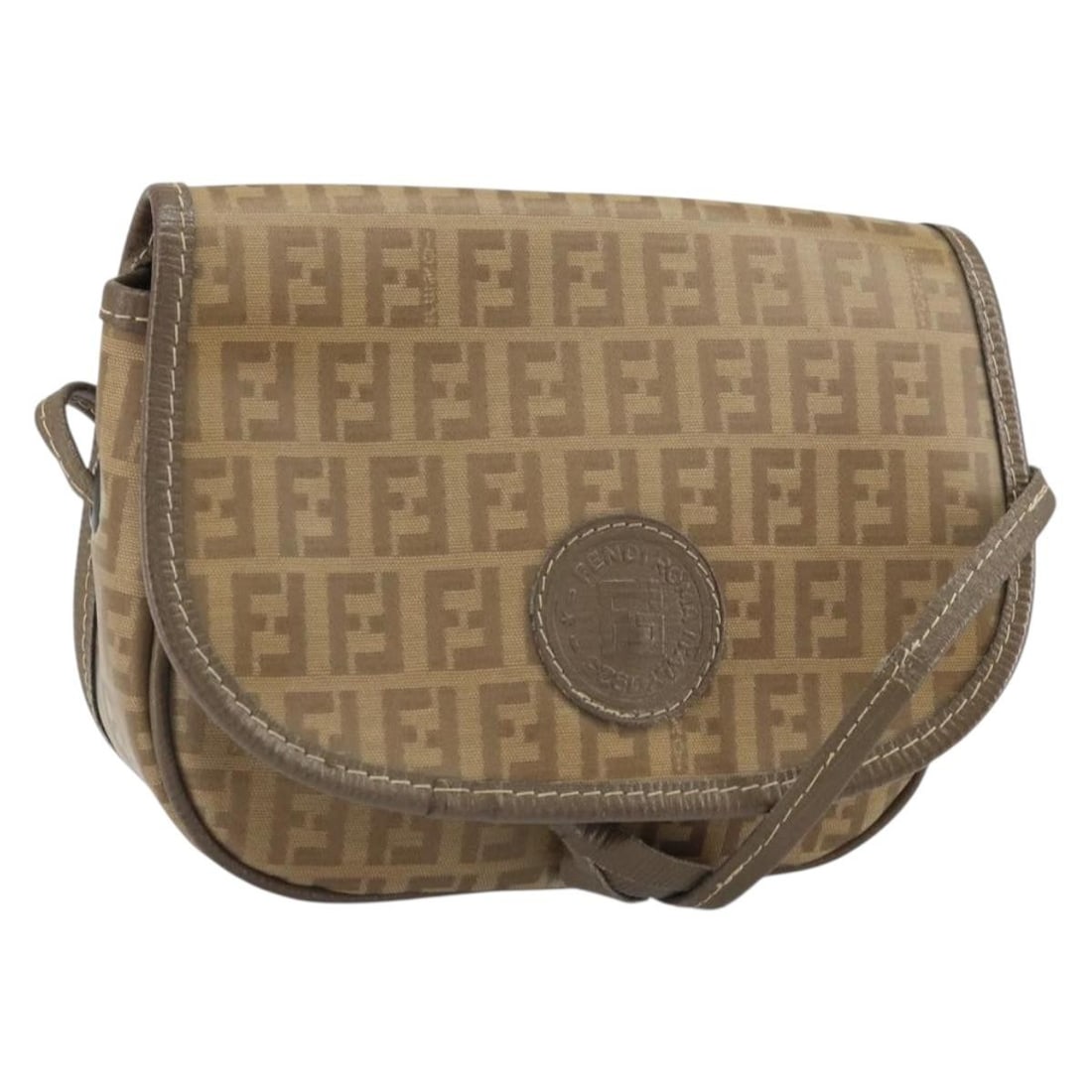Beige Zucchino Coated Canvas Shoulder Bag by FENDI: Beige Zucchino Coated Canvas Shoulder Bag by FENDI This FENDI Zucchino Canvas shoulder bag is crafted from beige coated canvas and features the iconic Zucchino pattern. The bag is designed with a sing