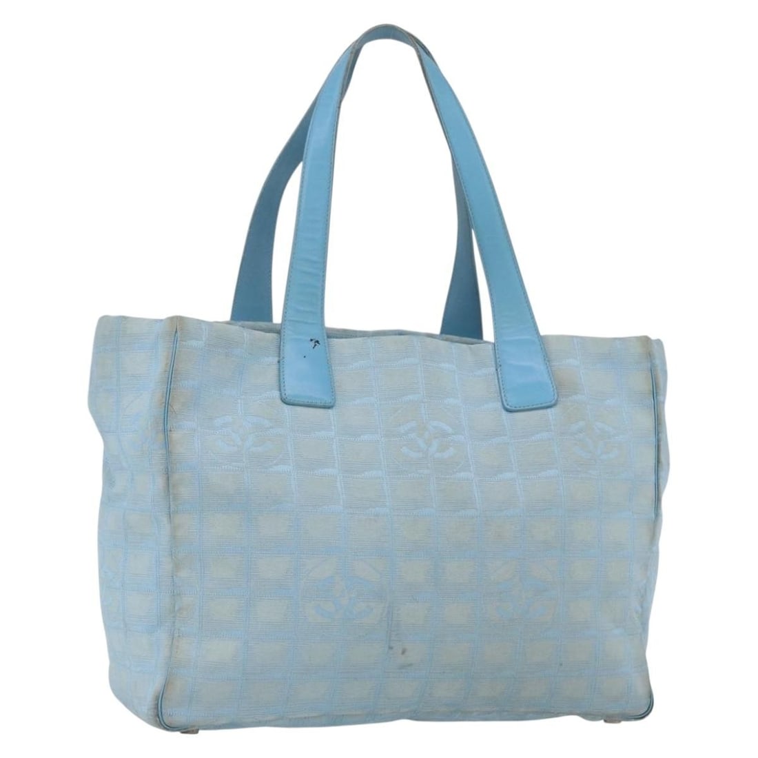 Chanel New Travel Line Blue Nylon Tote with Silver CC Logo and Card: Chanel New Travel Line Blue Nylon Tote with Silver CC Logo and Card This is a CHANEL Travel Line tote bag crafted from blue and silver nylon. The bag features dual top handles, a spacious interior, an