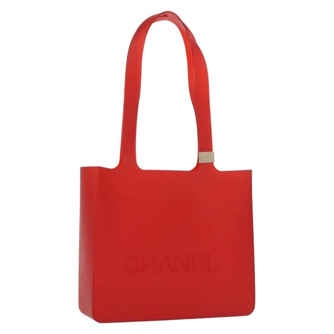 Red Rubber Tote Bag by CHANEL with CC Logo: Red Rubber Tote Bag by CHANEL with CC Logo This CHANEL tote bag features a bold red exterior crafted from rubber, highlighted by the iconic CC logo. The bag is designed in a compact tote style, offeri
