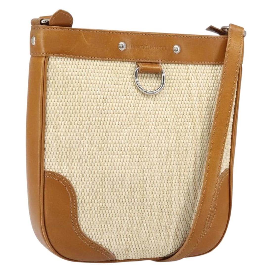 Beige Canvas Burberry Shoulder Bag with Silver Accents: Beige Canvas Burberry Shoulder Bag with Silver Accents This Burberry shoulder bag features a beige and silver canvas exterior with an adjustable strap for versatile wear. The bag shows signs of heavy