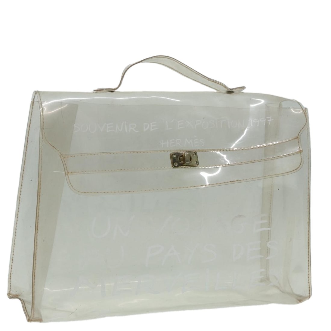 Clear Vinyl Kelly Handbag by Hermes: Clear Vinyl Kelly Handbag by Hermes This Hermes Kelly hand bag features a clear vinyl exterior with a structured silhouette and top handle design. The bag is made in France and showcases the iconic Ke