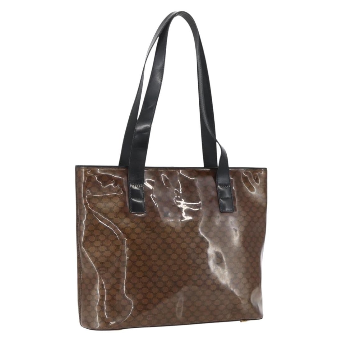 Brown Vinyl Shoulder Bag by CELINE Macadam Canvas Gold Accent: Brown Vinyl Shoulder Bag by CELINE Macadam Canvas Gold Accent This CELINE Macadam canvas shoulder bag features a combination of brown and gold vinyl with the signature Macadam pattern. Crafted in Ital