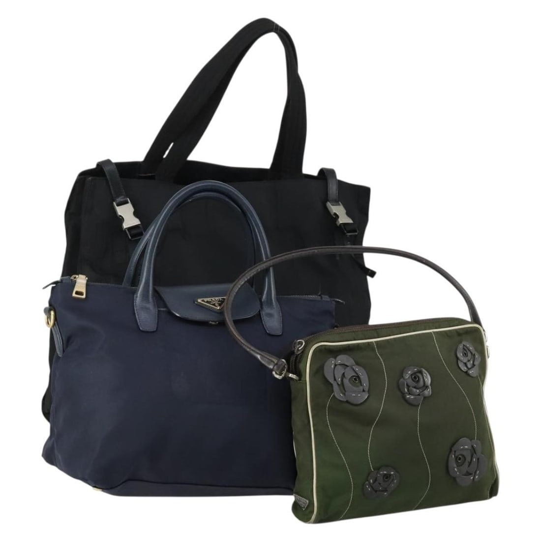 Three Piece PRADA Nylon Handbag Collection in Khaki Navy and Black: Three Piece PRADA Nylon Handbag Collection in Khaki Navy and Black This is a set of three Prada hand bags crafted from nylon in khaki, navy, and black. Made in Italy, these bags are heavily used and s