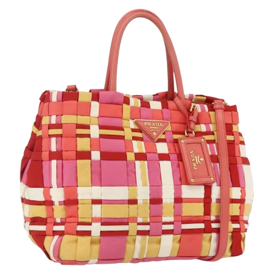 Red Nylon PRADA Convertible Top Handle and Shoulder Bag with Gold Details: Red Nylon PRADA Convertible Top Handle and Shoulder Bag with Gold Details This PRADA 2-way hand bag is crafted from durable nylon in a striking red color with gold-tone accents. Made in Italy, it feat