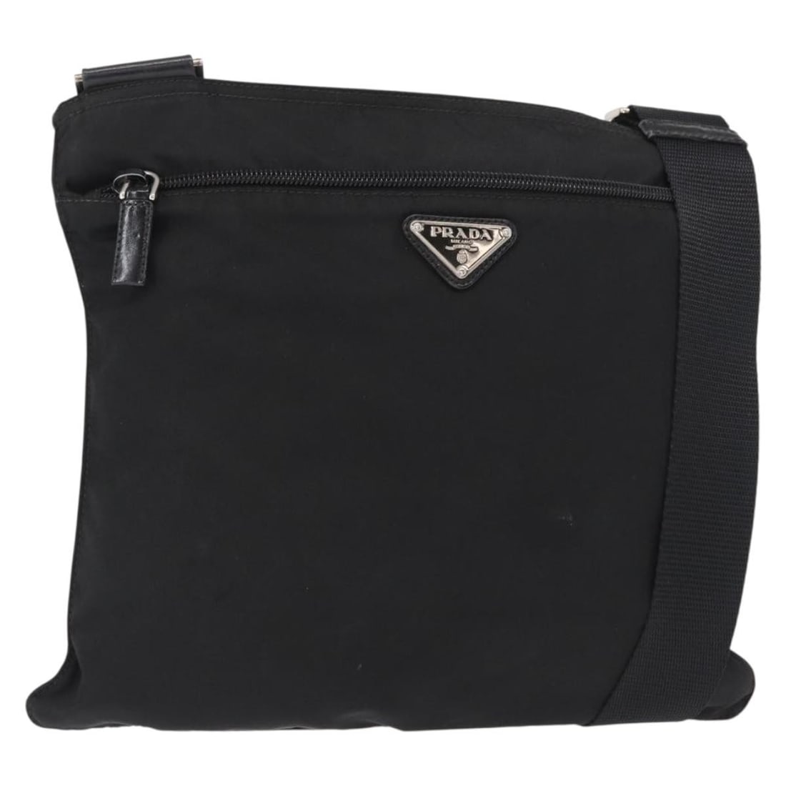 Black Nylon PRADA Shoulder Bag with Silver Tone Details and Adjustable Strap: Black Nylon PRADA Shoulder Bag with Silver Tone Details and Adjustable Strap This PRADA shoulder bag is crafted from black nylon with silver-tone accents. Designed with a practical adjustable shoulder