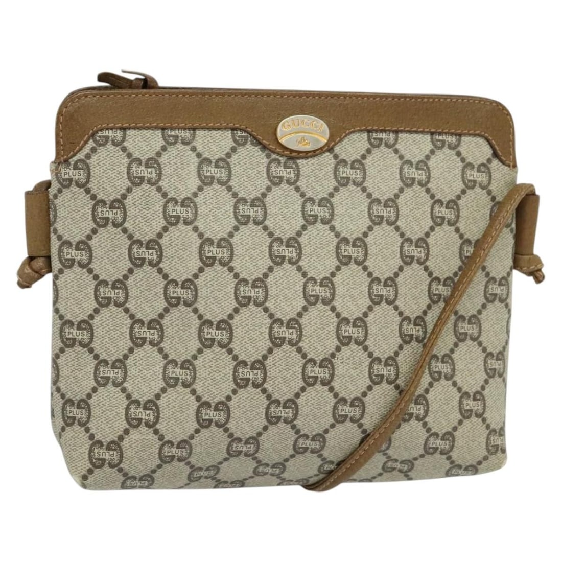 GUCCI GG Plus Supreme Beige PVC Shoulder Bag Made in Italy: GUCCI GG Plus Supreme Beige PVC Shoulder Bag Made in Italy This authentic GUCCI GG Plus Supreme Shoulder Bag is crafted from durable PVC leather in a chic beige hue. It features a compact design,