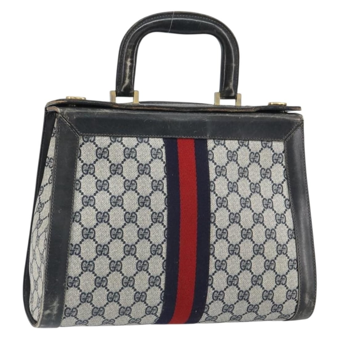 Navy Gold GG Canvas Sherry Line Handbag by Gucci: Navy Gold GG Canvas Sherry Line Handbag by Gucci This is a Gucci GG Canvas Sherry Line handbag featuring a navy and gold color scheme. The bag is crafted from GG canvas material and was made in Italy.