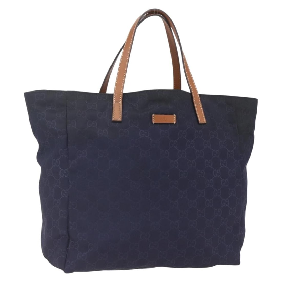 Navy GG Nylon Tote by Gucci Model 282439: Navy GG Nylon Tote by Gucci Model 282439 This is a Gucci GG tote bag crafted from navy nylon and GG canvas. Made in Italy, the bag features a spacious design with dual handles and a drop length of app