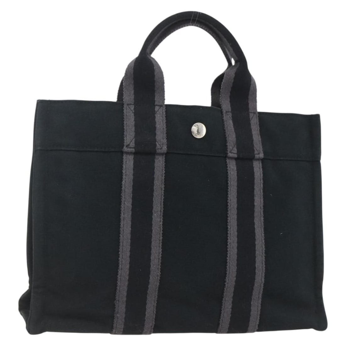 Black Cotton Fourre Tout PM Tote by Hermes Silver Accents: Black Cotton Fourre Tout PM Tote by Hermes Silver Accents This HERMES Fourre Tout PM hand bag features a black and silver cotton exterior with silver-tone metal fittings. Made in France, the bag inclu