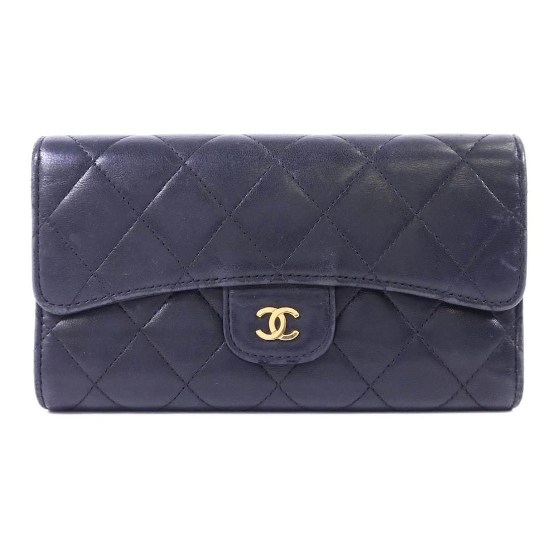 Black Lambskin Tri-Fold Long Wallet by CHANEL with Gold Hardware: Black Lambskin Tri-Fold Long Wallet by CHANEL with Gold Hardware This CHANEL tri-fold long wallet is crafted from black lambskin leather, offering a luxurious feel and classic style. The wallet featur
