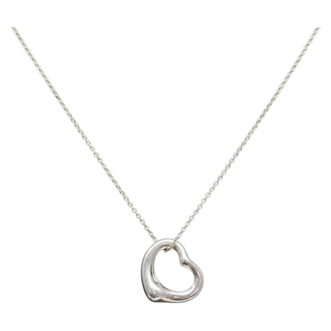 Tiffany & Co. Open Heart Necklace Sterling Silver Auth AM8917: Tiffany & Co. Open Heart Necklace Sterling Silver Auth AM8917 This exquisite Tiffany & Co. Open Heart Necklace is crafted from high-quality Ag925 silver, showcasing a timeless design that embodies ele