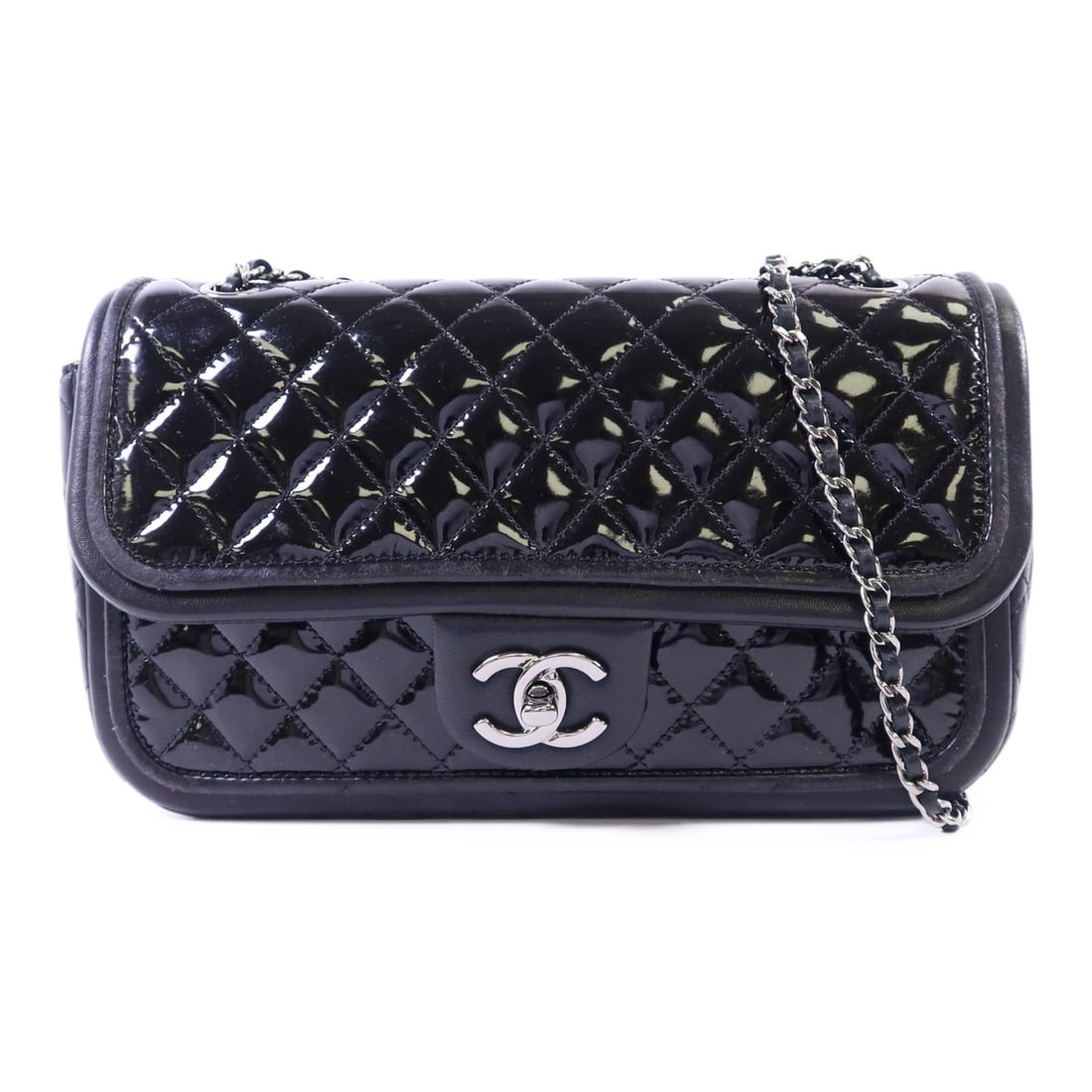 Black Patent Leather Shoulder Bag with CC Logo and Silver Hardware by Chanel: Black Patent Leather Shoulder Bag with CC Logo and Silver Hardware by Chanel This CHANEL shoulder bag is crafted from black patent leather and features a classic CC design with silver-tone hardware. M