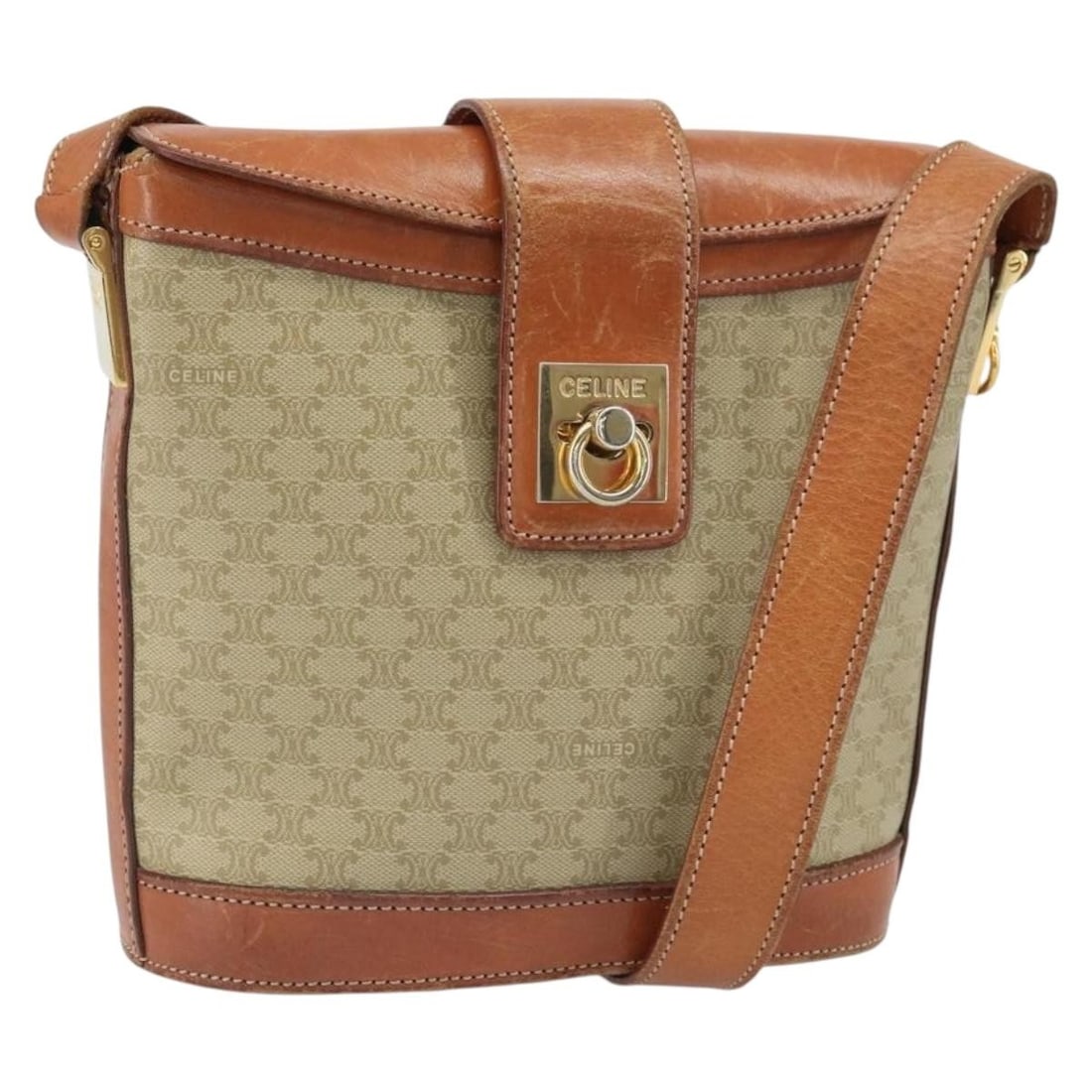 Beige Macadam PVC Shoulder Bag by CELINE with Gold Accents: Beige Macadam PVC Shoulder Bag by CELINE with Gold Accents This CELINE Macadam canvas shoulder bag features beige and gold PVC leather with the signature Macadam pattern. Designed with a structured si