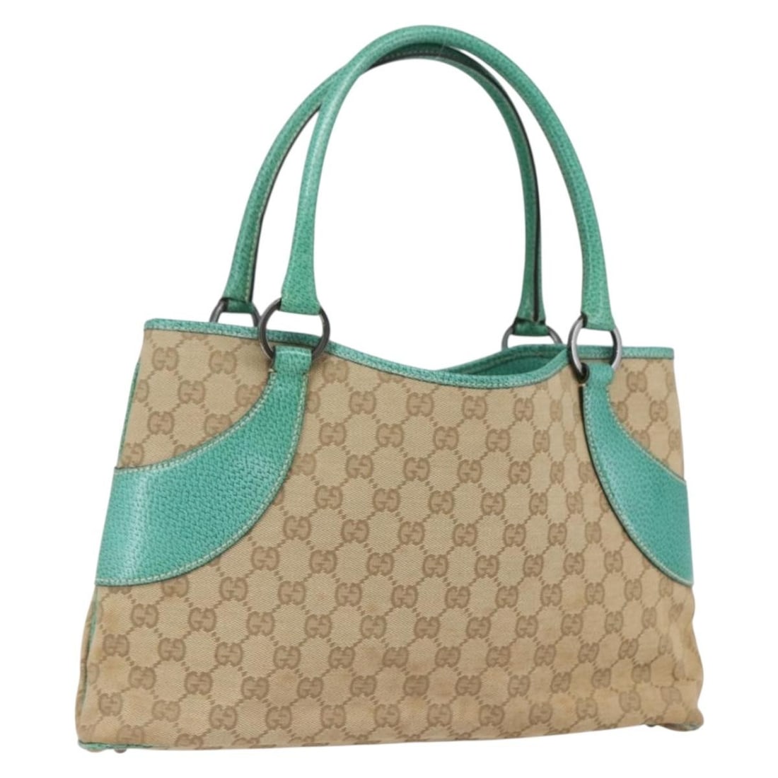 Beige Silver GG Canvas Tote by Gucci Model 113015: Beige Silver GG Canvas Tote by Gucci Model 113015 This Gucci GG Canvas tote bag features a beige and silver color scheme with the iconic GG canvas exterior. The bag is crafted in Italy and designed wi