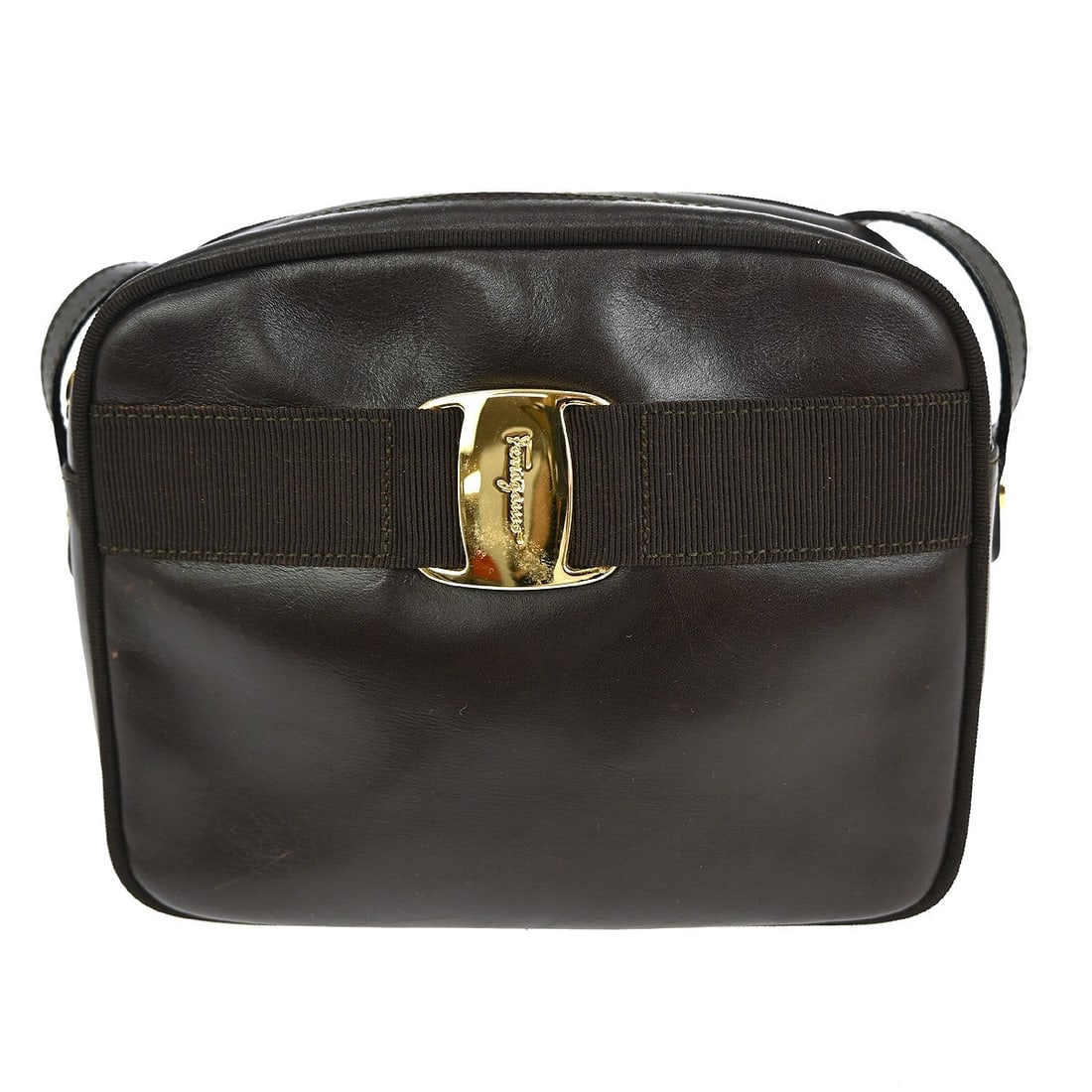 Salvatore Ferragamo Vara Mini Brown Leather Shoulder Bag with Ribbon Accent: Salvatore Ferragamo Vara Mini Brown Leather Shoulder Bag with Ribbon Accent This stylish mini shoulder bag from Salvatore Ferragamo features a rich brown leather exterior with the iconic Vara ribbon a