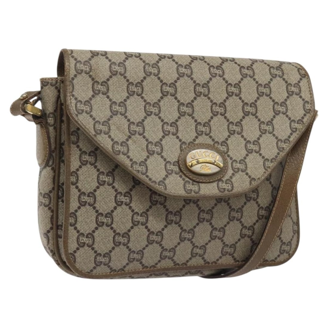 GUCCI GG Plus Supreme Beige Gold PVC Shoulder Bag Italy: GUCCI GG Plus Supreme Beige Gold PVC Shoulder Bag Italy This authentic GUCCI GG Plus Supreme Shoulder Bag is crafted from durable PVC leather in a stylish beige and gold color scheme. With dimensions