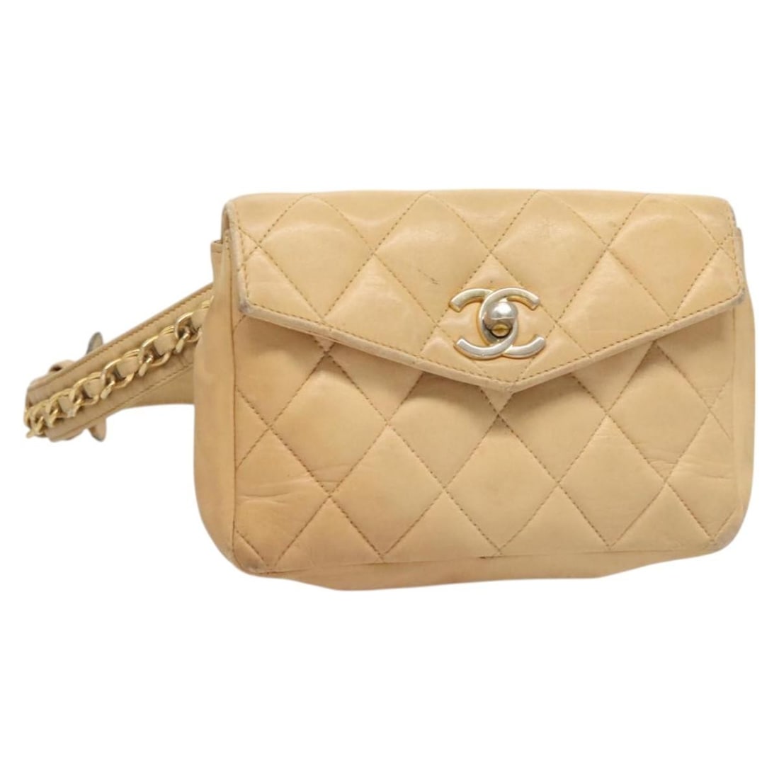 Beige Lambskin Matelasse Waist Bag by CHANEL with Gold Chain CC Logo: Beige Lambskin Matelasse Waist Bag by CHANEL with Gold Chain CC Logo This CHANEL Matelasse waist bag is crafted from beige lambskin leather with gold-tone accents. The bag features a chain waist strap