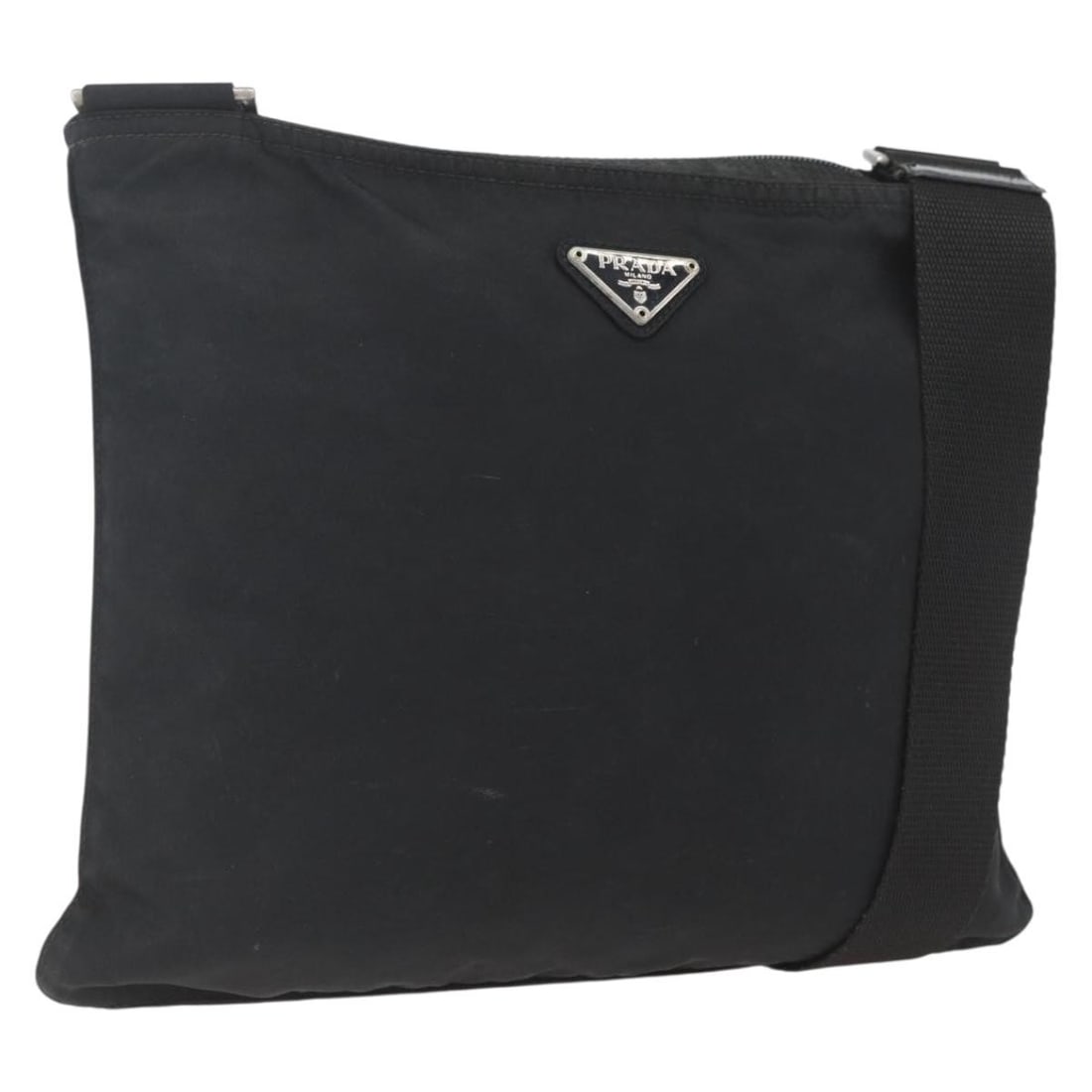 Black Nylon PRADA Shoulder Bag with Silver Accents Made in Italy: Black Nylon PRADA Shoulder Bag with Silver Accents Made in Italy This PRADA shoulder bag is crafted from black nylon with silver-tone accents, designed for versatile everyday use. Made in Italy, the b