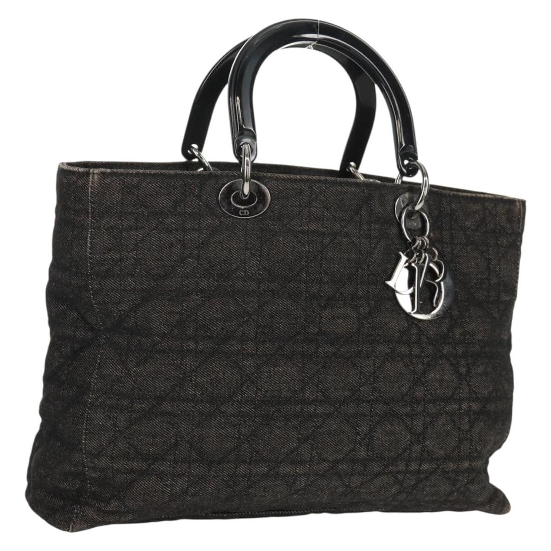 Lady Dior Denim Canvas Black Silver Handbag by Christian Dior with Charm: Lady Dior Denim Canvas Black Silver Handbag by Christian Dior with Charm This Christian Dior Lady Dior Canage handbag features a black and silver canvas exterior with silver-tone hardware and an attac