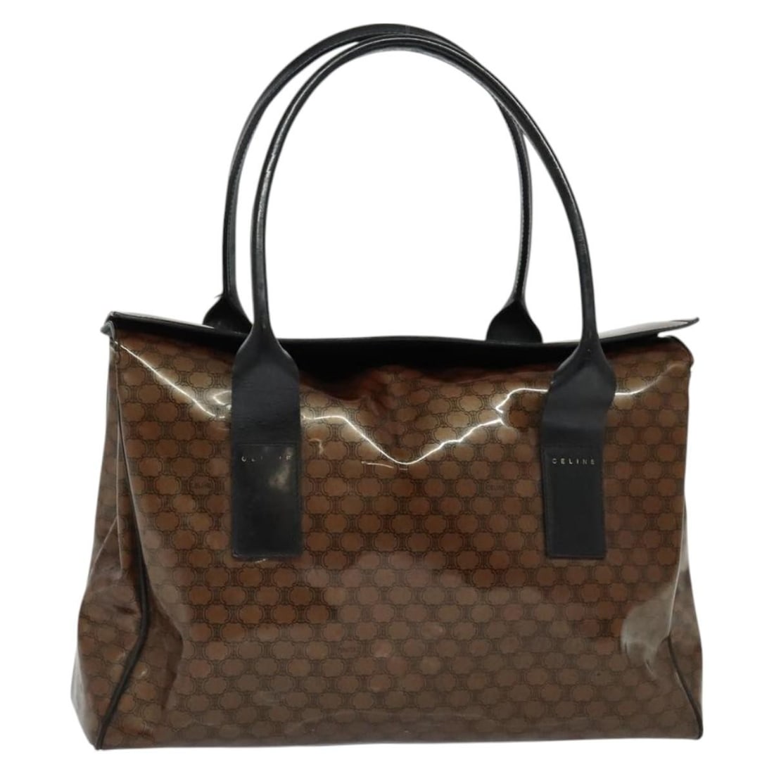 CELINE Brown Gold Enamel Macadam Hand Bag Made in Italy: CELINE Brown Gold Enamel Macadam Hand Bag Made in Italy Introducing the CELINE Macadam Canvas Hand Bag, a stylish accessory that combines elegance with functionality. This hand bag features a luxuriou