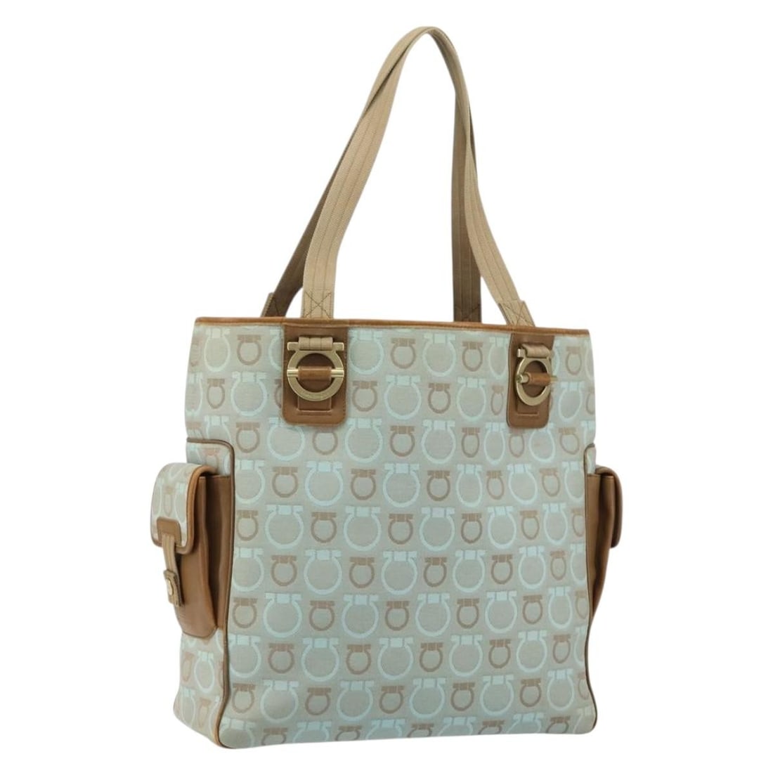 Light Blue Canvas Gancini Tote by Salvatore Ferragamo Gold Accents: Light Blue Canvas Gancini Tote by Salvatore Ferragamo Gold Accents This Salvatore Ferragamo Gancini tote bag features a light blue and gold canvas exterior. The bag has a handle drop of approximately