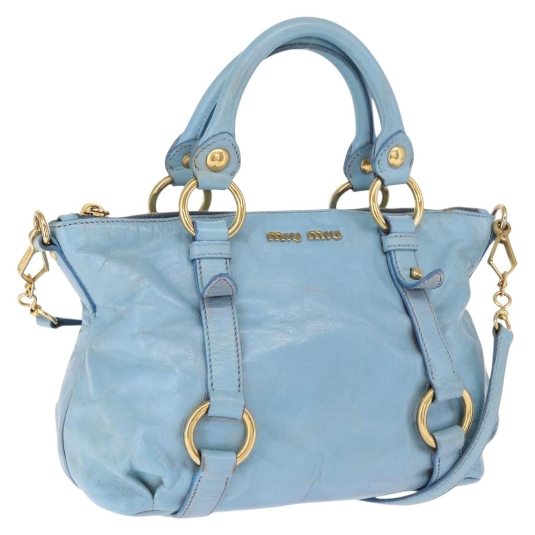 Light Blue Miu Miu Leather 2way Bag with Shoulder Strap and Gold Accents: Light Blue Miu Miu Leather 2way Bag with Shoulder Strap and Gold Accents This Miu Miu 2-way handbag is crafted from light blue leather and features gold-tone accents. The bag offers versatile carrying