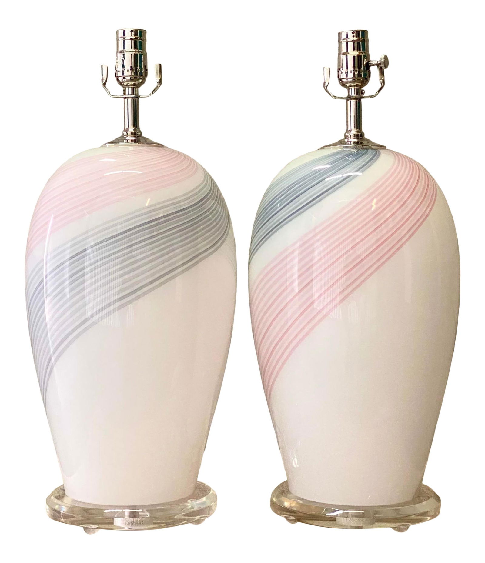 Restored Vintage Murano Glass Lamps with Pink Grey Swirl Design: Restored Vintage Murano Glass Lamps with Pink Grey Swirl Design This exquisite pair of vintage Murano glass lamps features a stunning swirl design in pink and grey, elegantly resting on a lucite plint