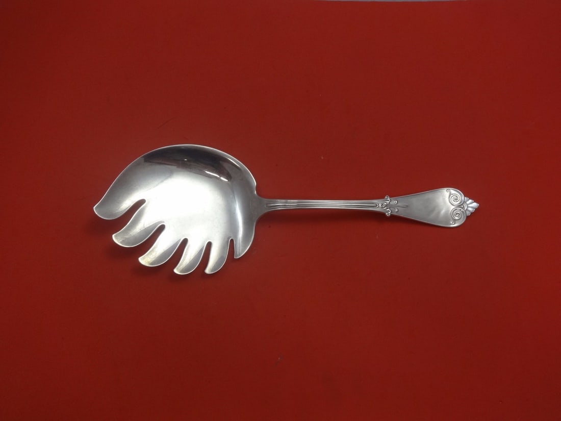 Tiffany & Co Beekman Sterling Silver Fried Oyster Server 9 1/4": Tiffany & Co Beekman Sterling Silver Fried Oyster Server 9 1/4" This exquisite Beekman Fried Oyster Server, crafted by Tiffany & Co., showcases the elegance of sterling silver. Measuring 9 1/4 inches,