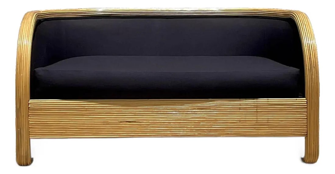 Chic Vintage 1980s Pencil Reed Loveseat in Black Upholstery: Chic Vintage 1980s Pencil Reed Loveseat in Black Upholstery Step into the charm of the 1980s with this stunning vintage pencil reed loveseat. With its iconic waterfall silhouette, this piece features