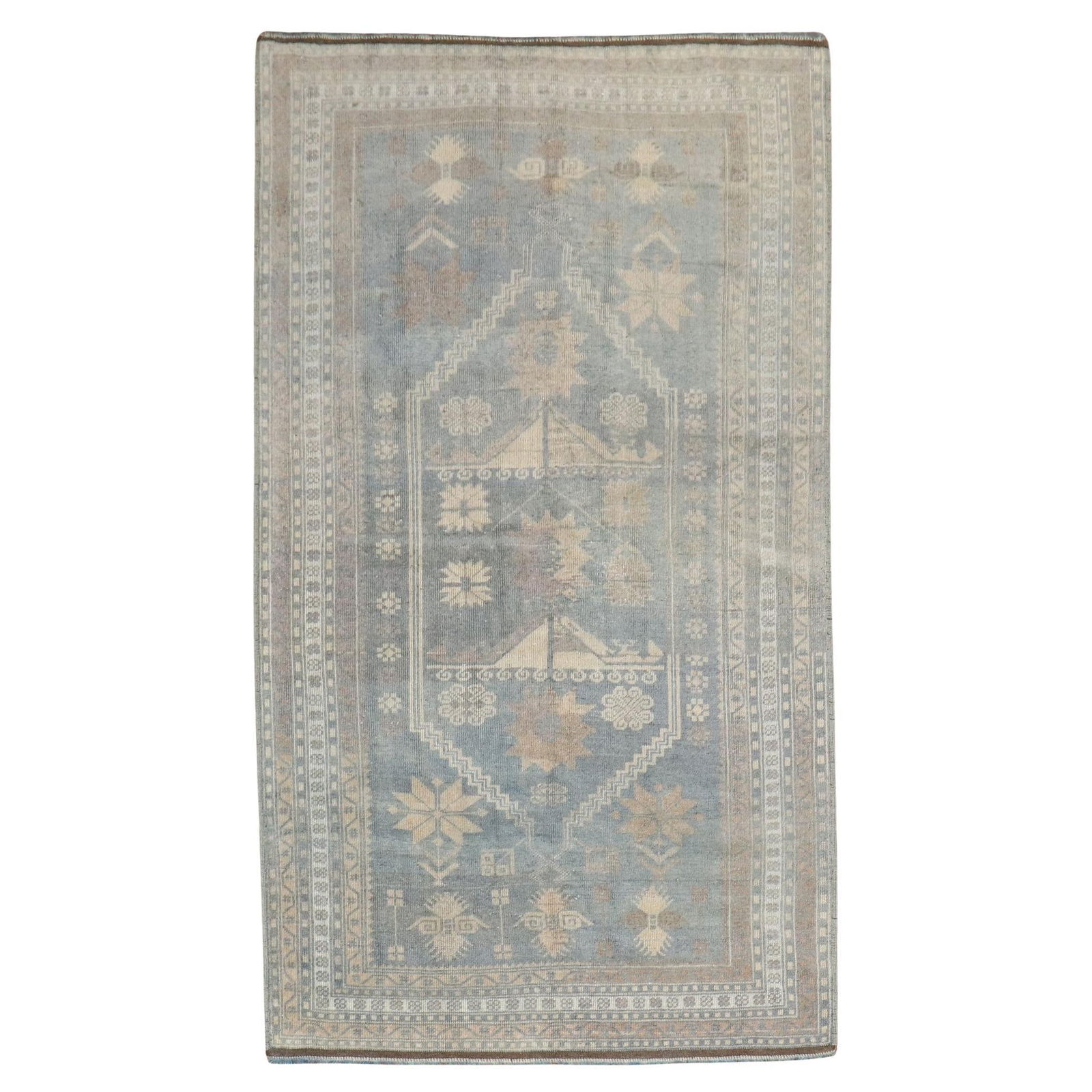 Hand-Knotted Vintage Turkish Rug Mid-Century Tribal Blue 43 x 73 in: Hand-Knotted Vintage Turkish Rug Mid-Century Tribal Blue 43 x 73 in This exquisite vintage Turkish rug from the Zabihi Collection features a captivating tribal motif primarily in blue tones. Crafted i