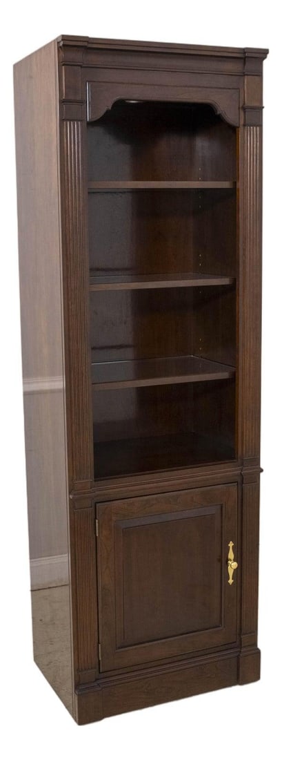 Stickley Cherry Wood Lighted Tall Bookcase with Raised Panel Doors: Stickley Cherry Wood Lighted Tall Bookcase with Raised Panel Doors This Stickley Cherry Lighted Tall Glass Shelf Open Bookcase is a stunning piece of furniture that combines functionality with elegant