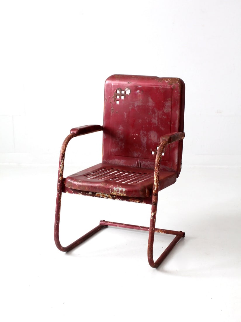 Mid Century Art Deco Cantilever Patio Chair Raspberry Red: Mid Century Art Deco Cantilever Patio Chair Raspberry Red This mid-century patio chair combines art deco style with functional design. Crafted from cantilever steel, the chair features a unique basket