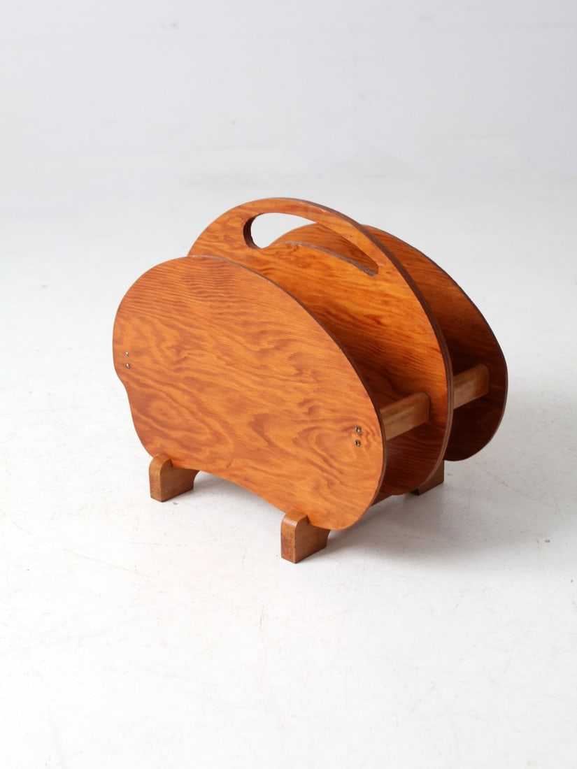 Handmade Mid-Century Wooden Magazine Rack with Curved Lines: Handmade Mid-Century Wooden Magazine Rack with Curved Lines Enhance your living space with this exquisite Mid-Century Folk Art Rack, meticulously crafted from wood. This magazine rack showcases