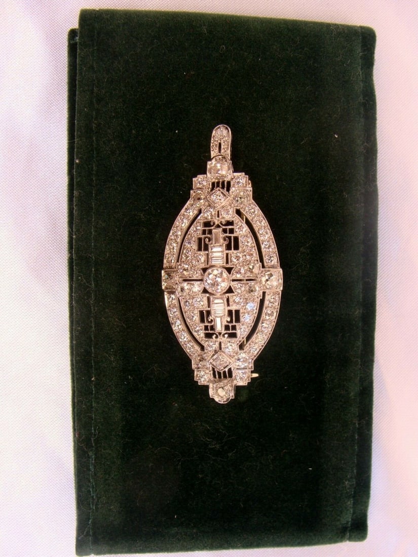 Kobrin Brothers Art Deco Platinum Diamond Pendant-Brooch 5.45 ct: Kobrin Brothers Art Deco Platinum Diamond Pendant-Brooch 5.45 ct Discover the elegance of this exquisite Art Deco pendant-brooch crafted in platinum by Kobrin Brothers. This stunning piece features in