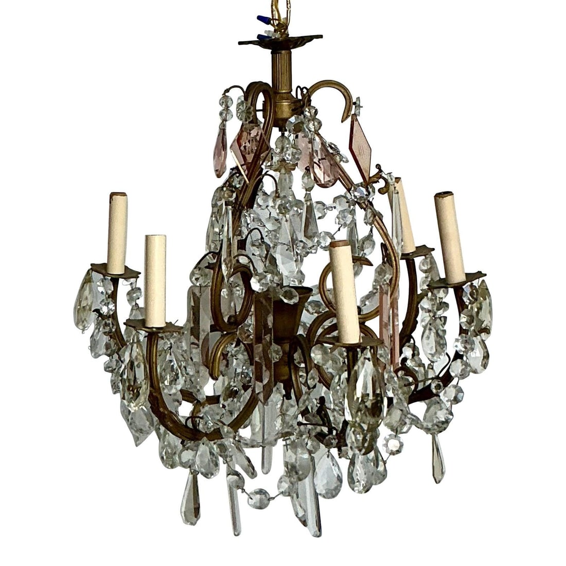 French Regency Brass and Amethyst Crystal Six-Light Chandelier Vintage: French Regency Brass and Amethyst Crystal Six-Light Chandelier Vintage This vintage French Regency-style chandelier features a substantial brass frame with a weathered patina and a striking cage silho
