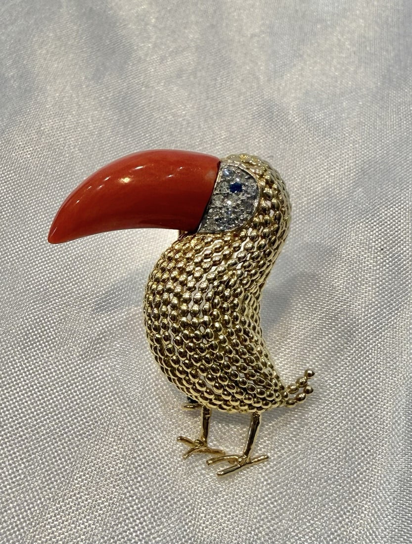 Diamond Sapphire and Coral Brooch in French 18K Yellow Gold: Diamond Sapphire and Coral Brooch in French 18K Yellow Gold This French brooch features a striking combination of 18k yellow gold, 14k white gold detailing, coral as the main stone, along with diamond