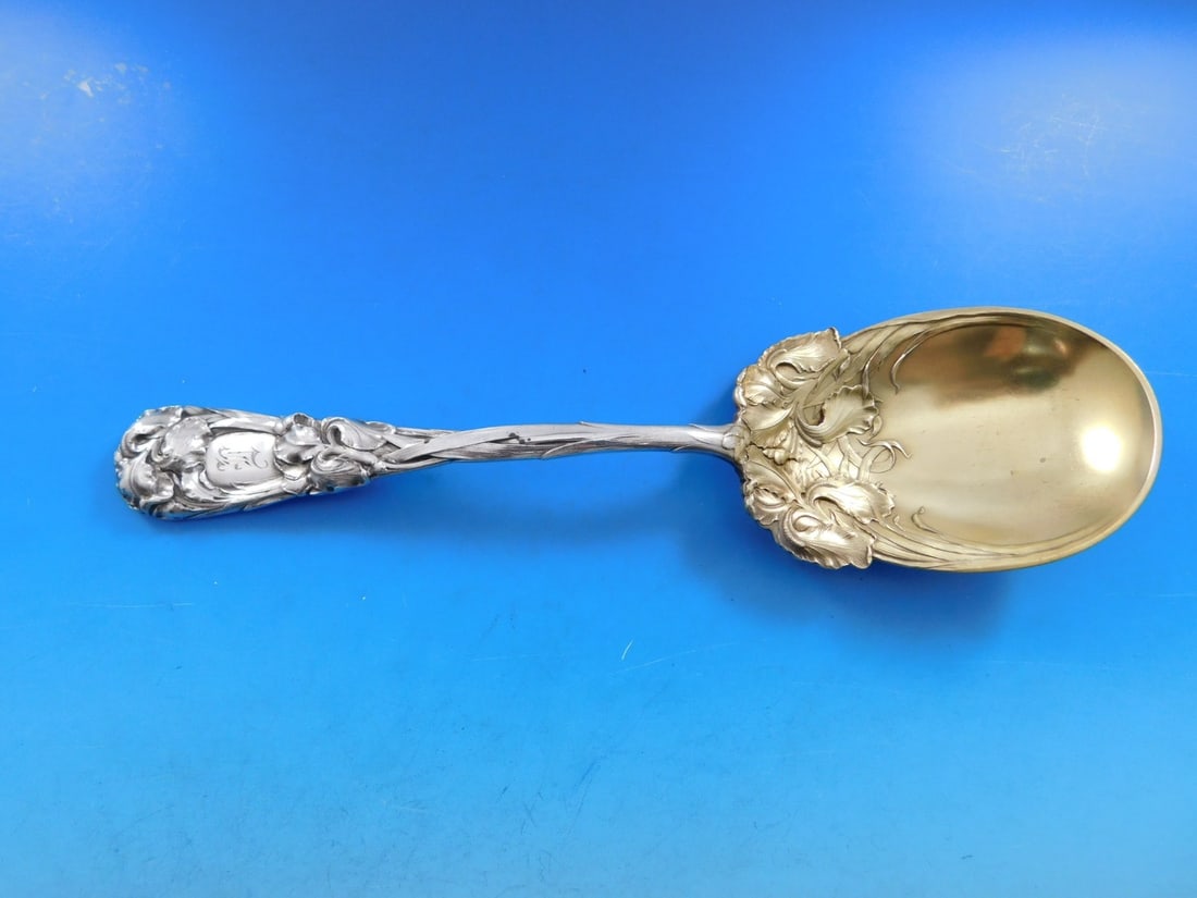 Durgin New Art Sterling Silver Berry Spoon 9 3/8" Iris Motif: Durgin New Art Sterling Silver Berry Spoon 9 3/8" Iris Motif This exquisite serving spoon is a stunning example of the New Art pattern crafted by Durgin. Made from high-quality sterling silver, this b