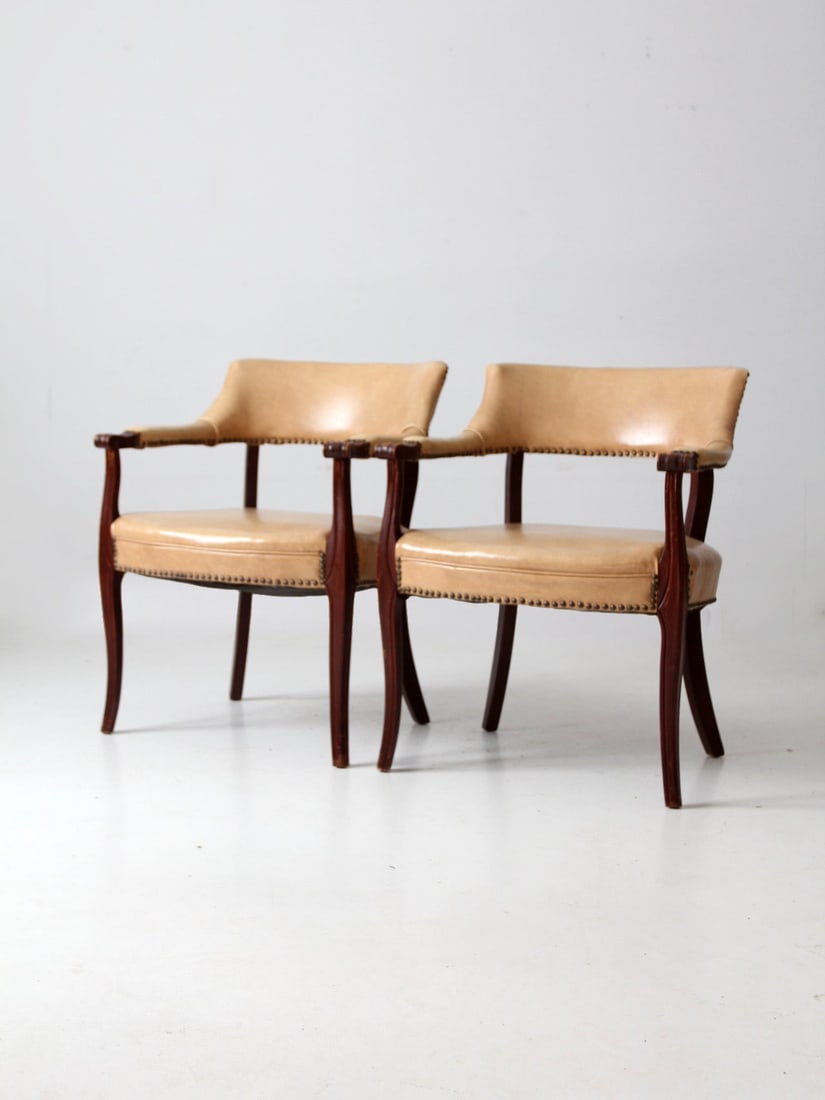 Pair of Mid Century Captain's Chairs with Brass Studs: Pair of Mid Century Captain's Chairs with Brass Studs Enhance your living space with this stylish pair of Mid Century Captain's Chairs, perfect for game tables or adding a touch of vintage charm to yo
