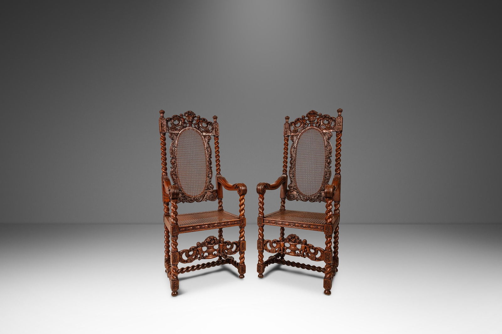 Antique 18th Century Set of 2 Jacobean Baroque Armchairs Oak Cane England: Antique 18th Century Set of 2 Jacobean Baroque Armchairs Oak Cane England This exquisite set of two antique armchairs showcases the remarkable craftsmanship of the 18th-century Jacobean Stuart/Baroque