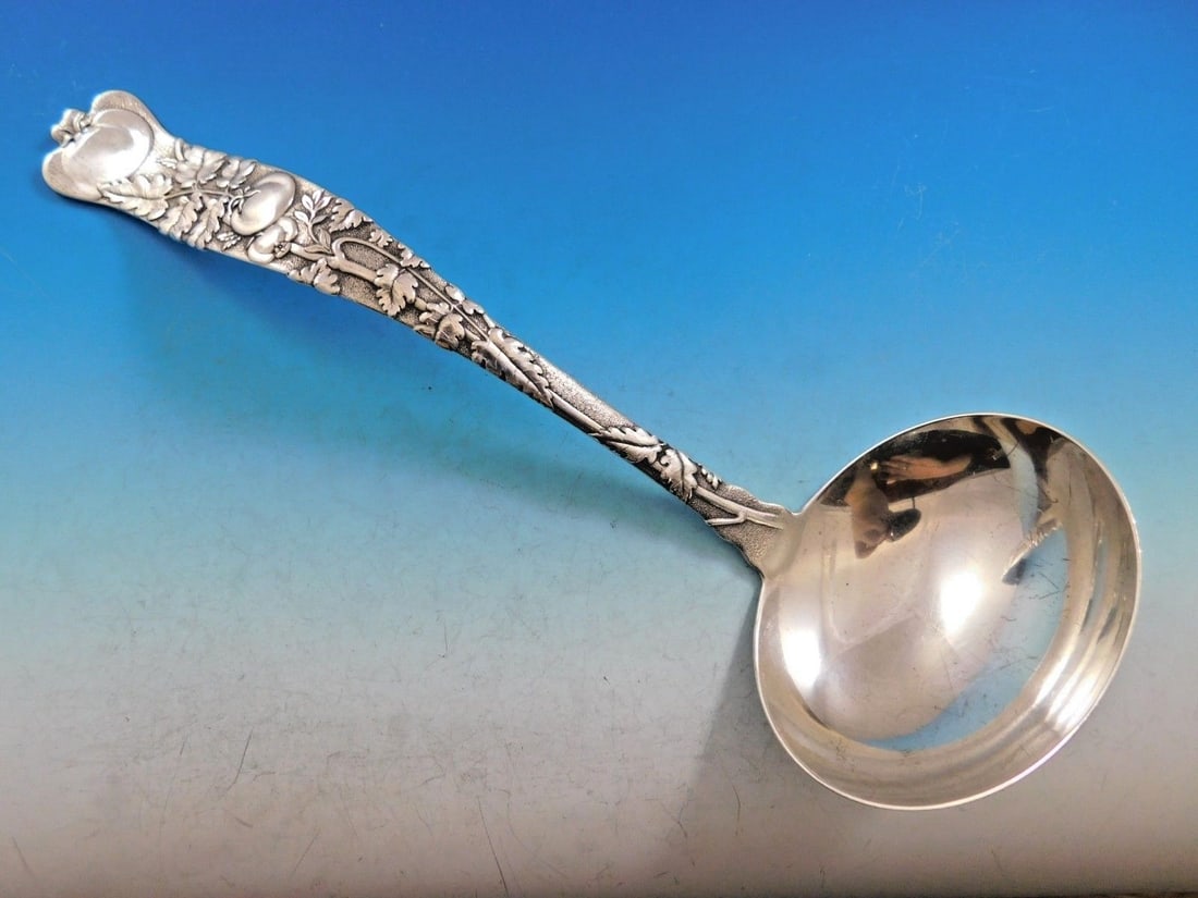 Tiffany & Co. Vine Sterling Silver Soup Ladle 11 with Tomato Motif: Tiffany & Co. Vine Sterling Silver Soup Ladle 11 with Tomato Motif Indulge in the elegance of the Vine by Tiffany & Co. sterling silver soup ladle, a stunning serving piece measuring 11". Crafted from