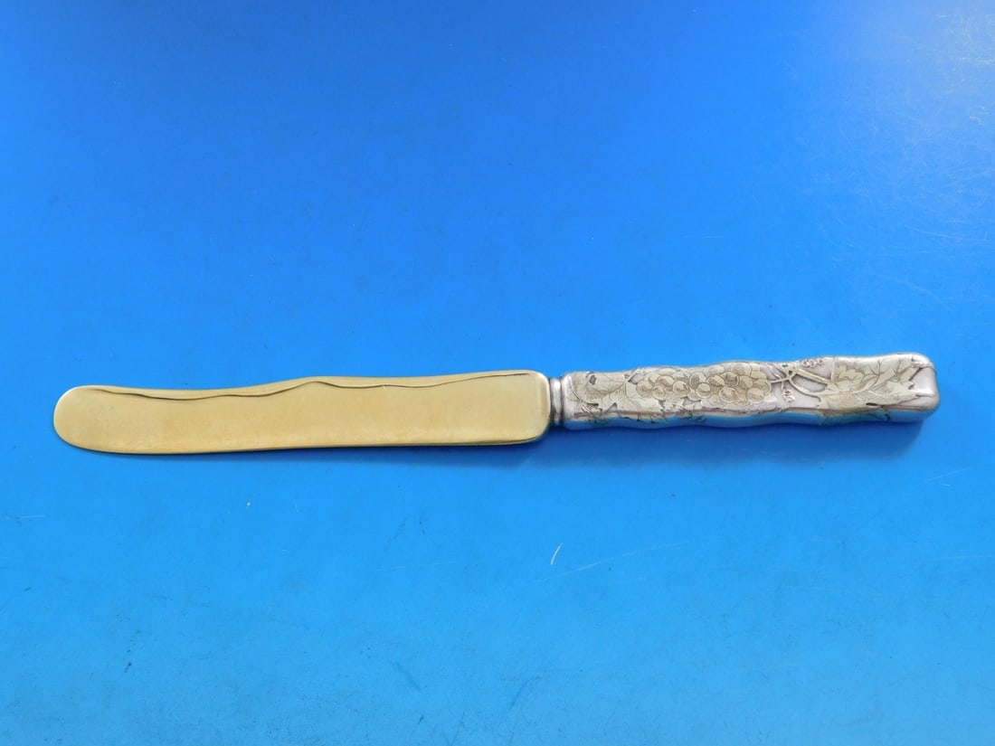 Tiffany & Co. Lap Over Edge Sterling Silver Dessert Knife Grapes Motif: Tiffany & Co. Lap Over Edge Sterling Silver Dessert Knife Grapes Motif This exquisite dessert knife features the iconic Lap Over Edge pattern by Tiffany & Co., crafted from high-quality sterling silve