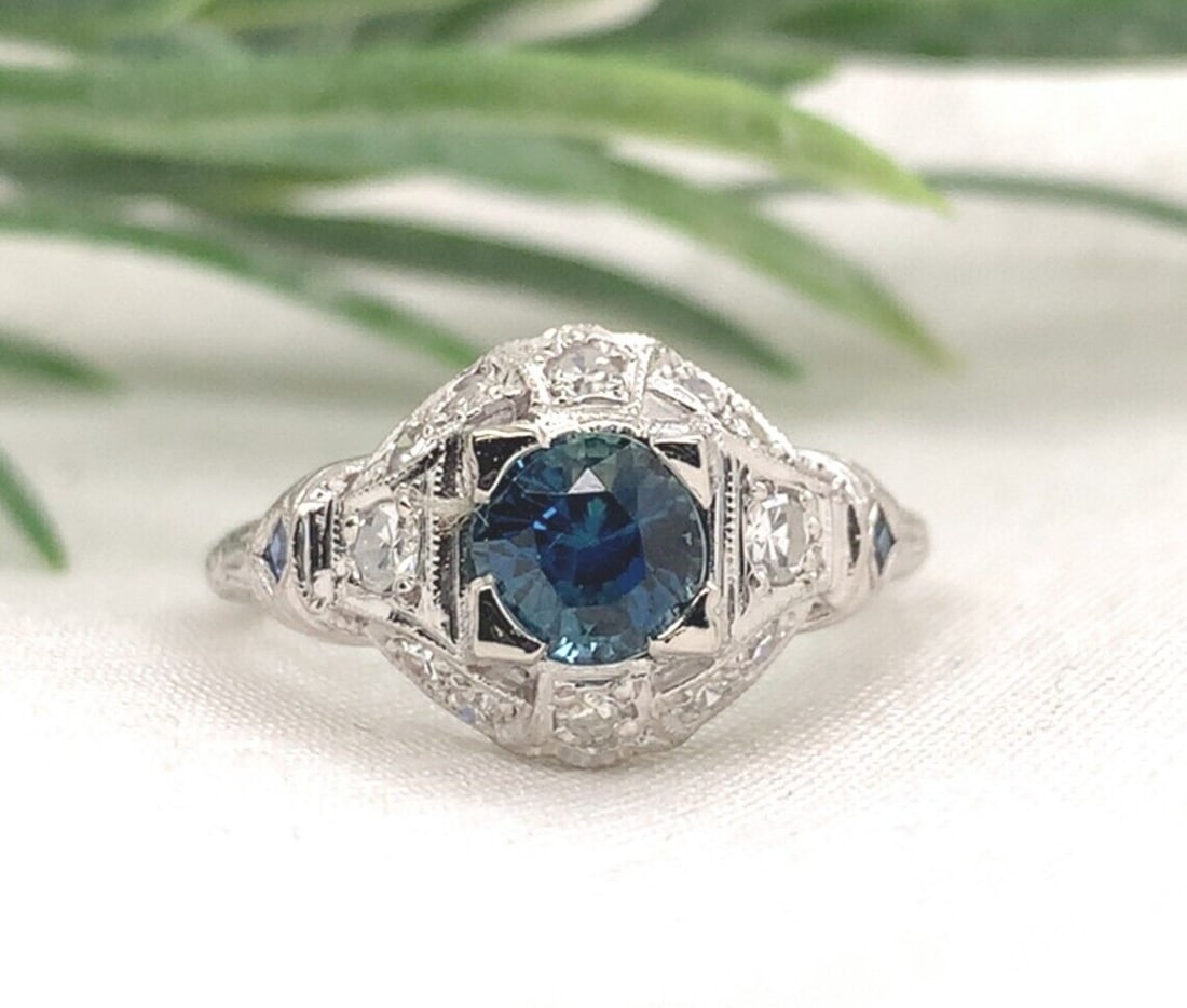 Art Deco Platinum 1.04ct Blue Sapphire Diamond Filigree Ring GIA Certified: Art Deco Platinum 1.04ct Blue Sapphire Diamond Filigree Ring GIA Certified This exquisite Art Deco ring showcases a stunning combination of a genuine 1.04 carat round brilliant cut blue sapphire and t