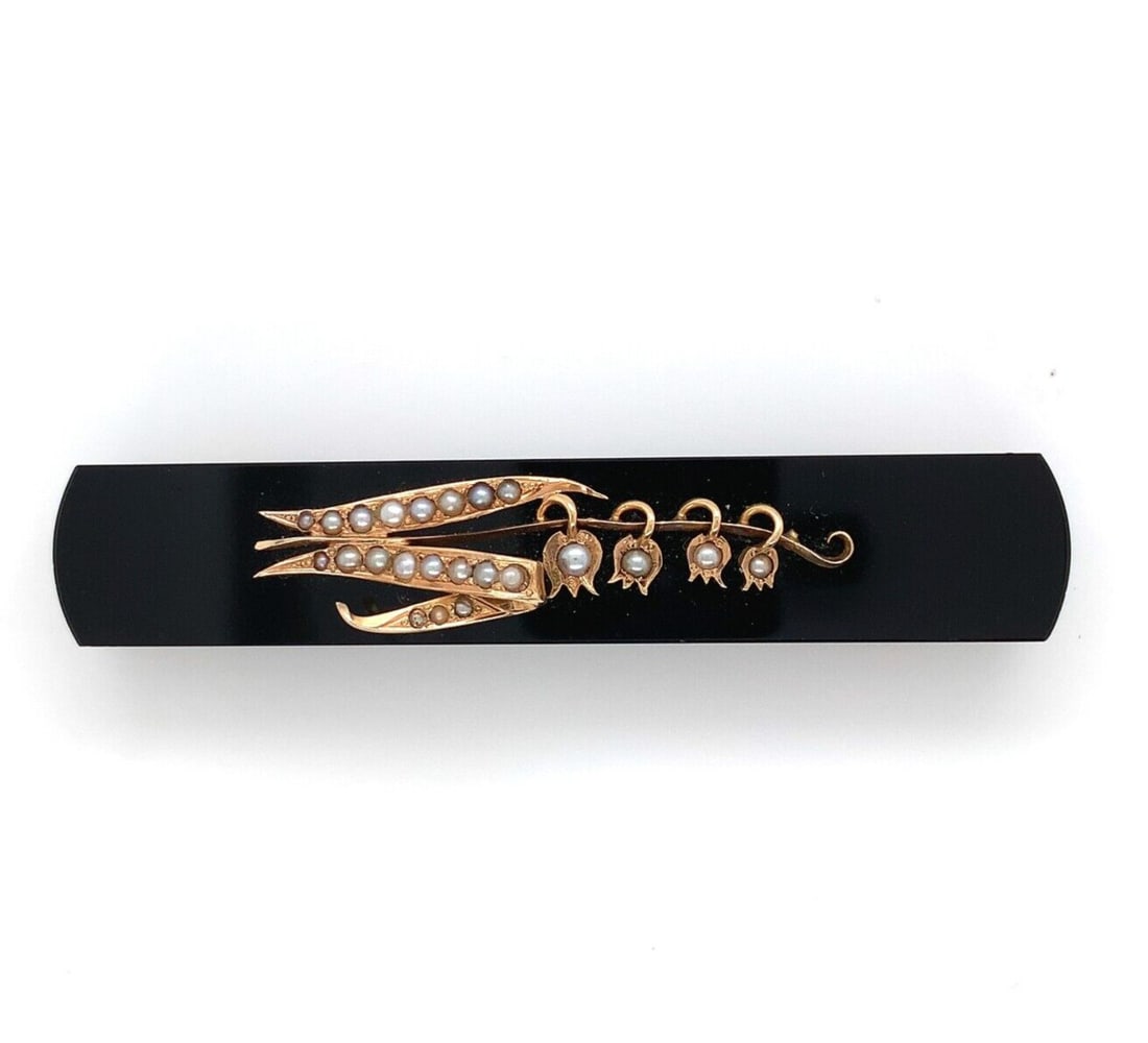 Victorian Era 14k Yellow Gold Bar Pin with Onyx and Seed Pearls: Victorian Era 14k Yellow Gold Bar Pin with Onyx and Seed Pearls This Victorian-era bar pin features a classic design crafted in 14k yellow gold, highlighted by a black onyx bar adorned with an applied