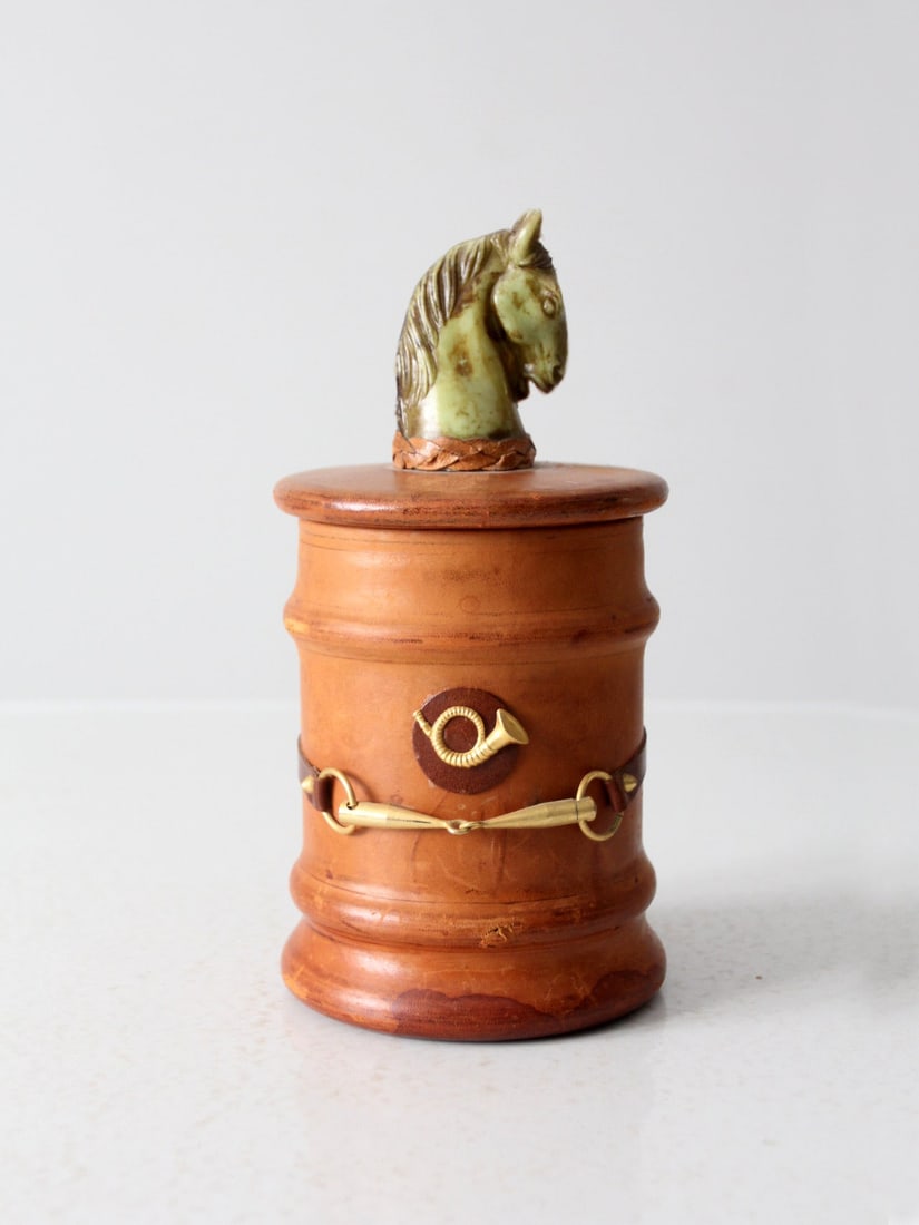 Vintage Italian Enesco Equestrian Humidor with Brass Details: Vintage Italian Enesco Equestrian Humidor with Brass Details Discover this exquisite vintage Italian equestrian-themed humidor by Enesco. This unique piece showcases a green glass jar elegantly wrappe