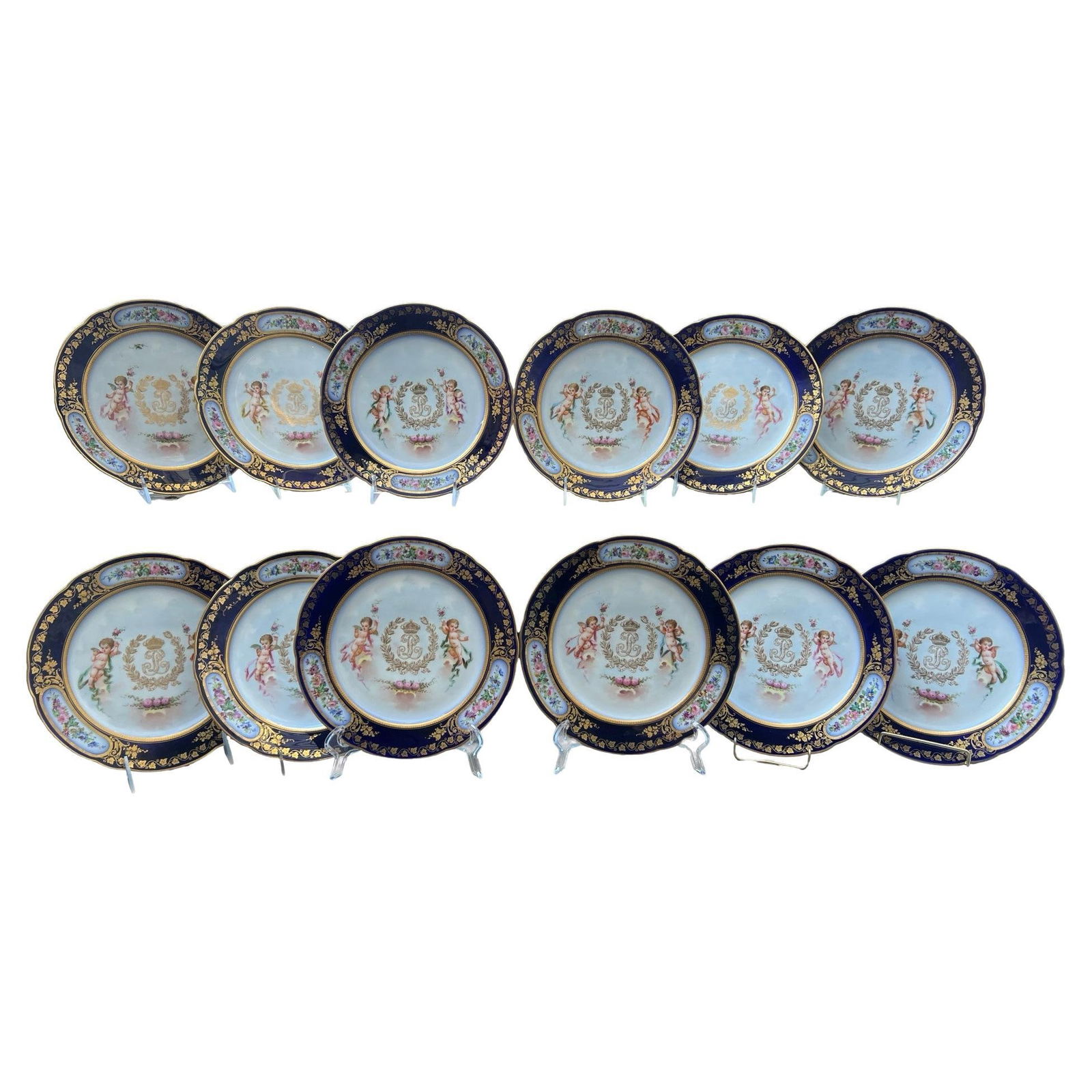 Set of 12 Sevres 1846 Louis Philippe Porcelain Plates: Set of 12 Sevres 1846 Louis Philippe Porcelain Plates This exquisite set of 12 porcelain plates, crafted by the renowned Sevres manufactory in 1846, showcases the opulent design associated with the Ch