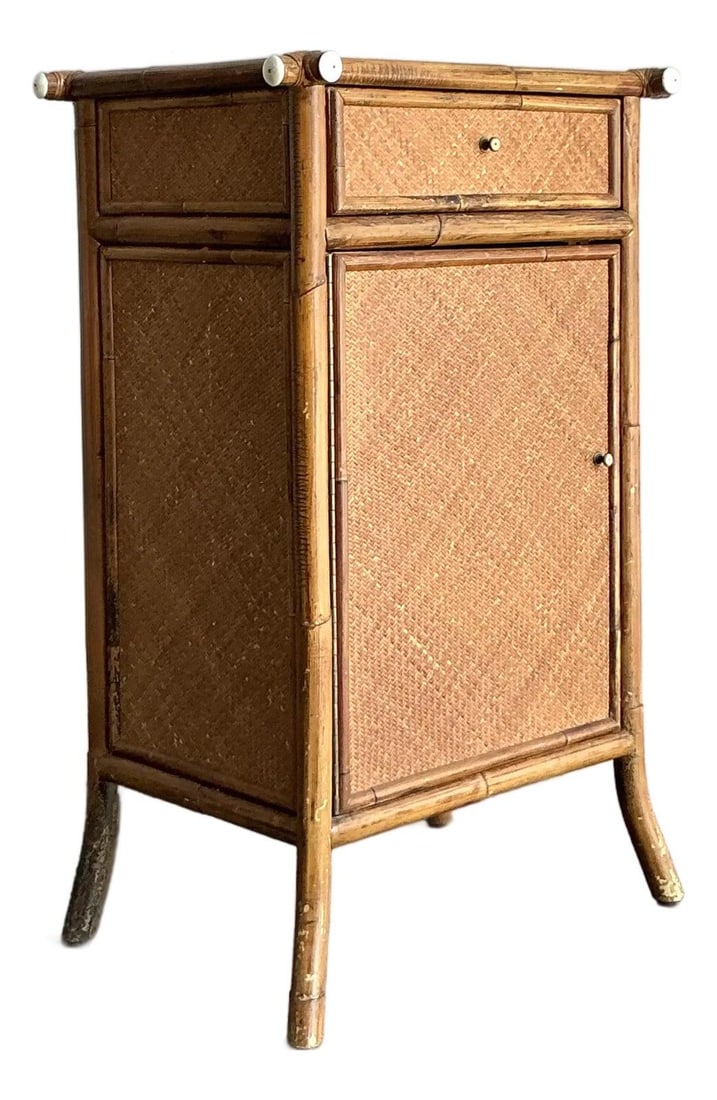 Bamboo and Woven Rattan Nightstand with Brass and Faux Ivory Accents: Bamboo and Woven Rattan Nightstand with Brass and Faux Ivory Accents This vintage nightstand exudes the distinctive charm of Tropical Modern and Hollywood Regency styles, crafted from sturdy jointed b