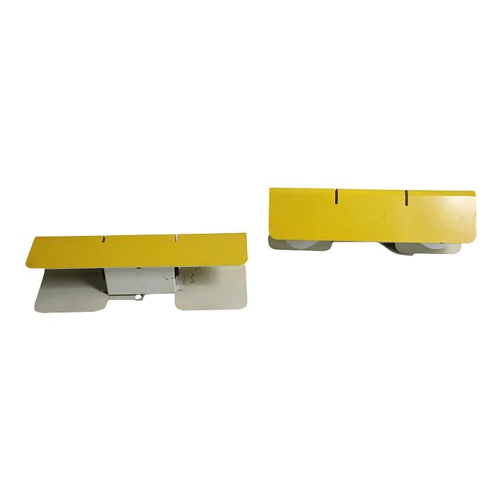 1970s Post-Modern Yellow Metal Sconce Pair Made in Spain: 1970s Post-Modern Yellow Metal Sconce Pair Made in Spain This sophisticated pair of post-modern sconces embodies minimalist design, crafted from bent steel with a vibrant yellow enamel and white paint