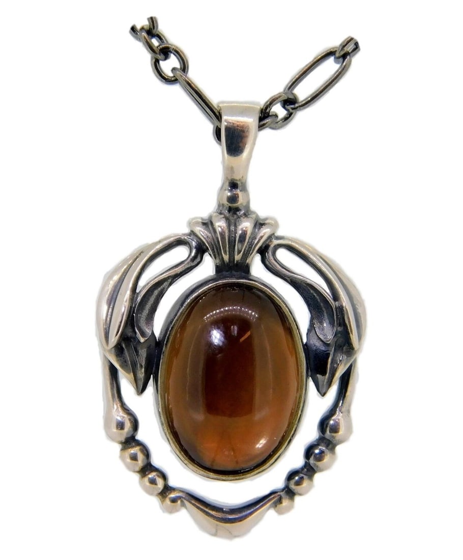 Georg Jensen 2014 Sterling Silver Smoky Quartz Pendant Necklace: Georg Jensen 2014 Sterling Silver Smoky Quartz Pendant Necklace This exquisite Georg Jensen pendant showcases a genuine natural smoky quartz stone, beautifully set in a sterling silver design. The pen