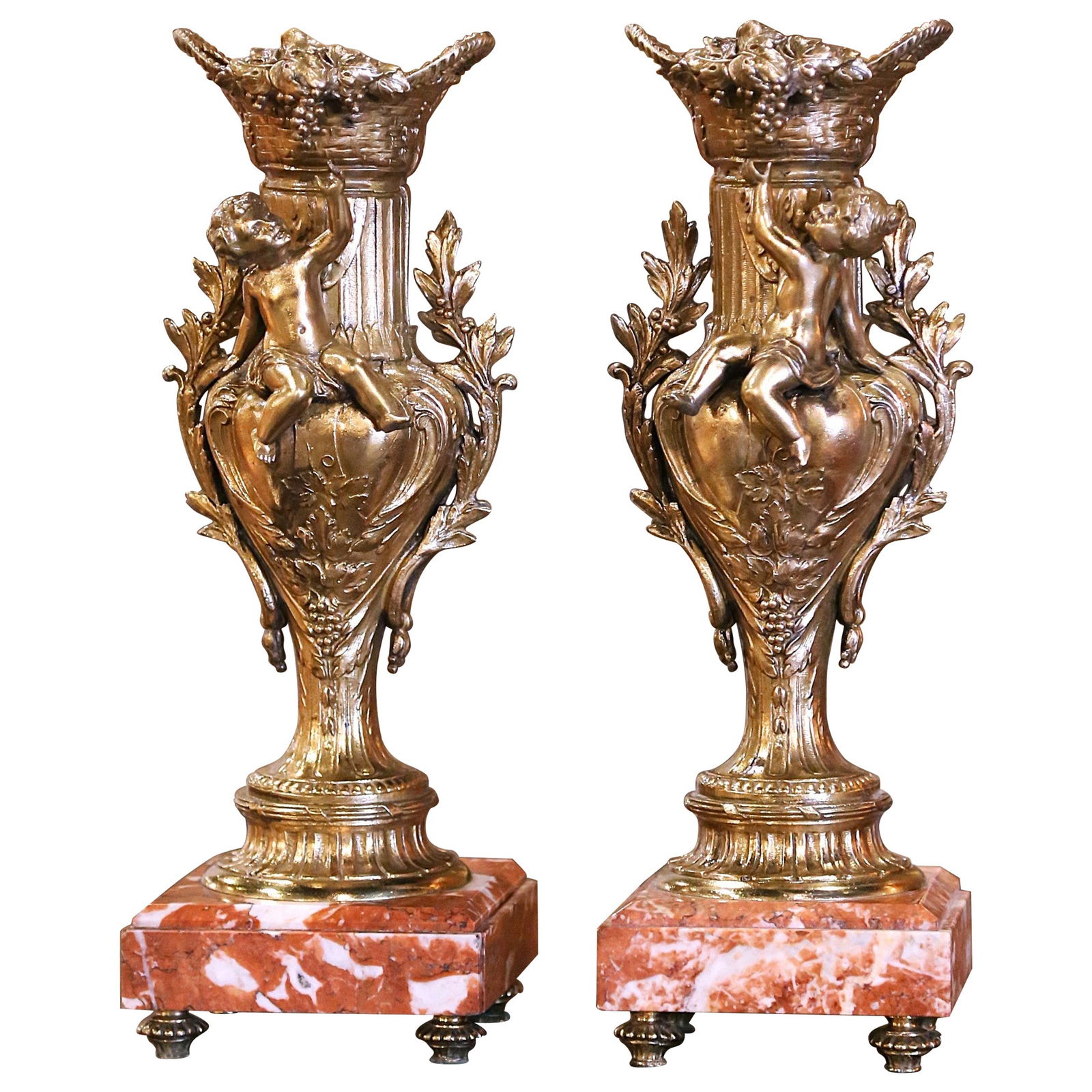 Antique Pair of 19th Century French Gilt Spelter Vases with Bacchus on Marble Bases: Antique Pair of 19th Century French Gilt Spelter Vases with Bacchus on Marble Bases This exquisite pair of 19th Century French vases embodies the elegance of the Napoleon III style, perfect for enhanc