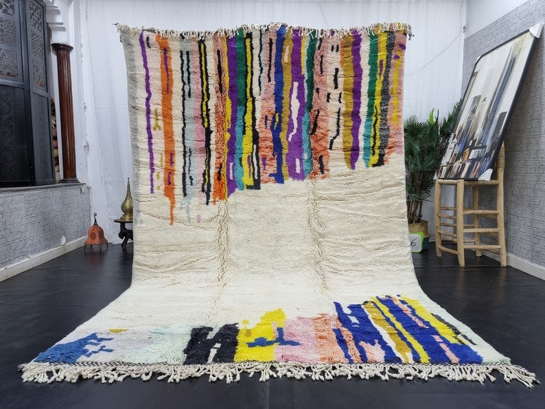 Handmade Moroccan Berber Wool Area Rug 9.84 x 6.56 Feet: Handmade Moroccan Berber Wool Area Rug 9.84 x 6.56 Feet Enhance your living space with this stylish and colorful handmade Moroccan Berber wool area rug. Expertly handwoven in the Atlas Mountains by sk